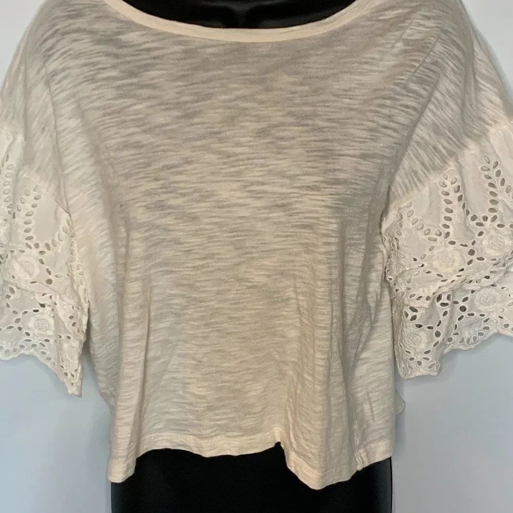 The Impeccable Pig Cream Cropped Lace Arm Accent Top
